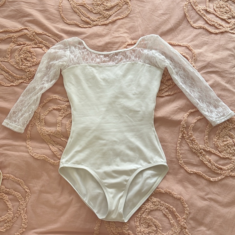 White lace ballet leotard with sleeves and the skirt